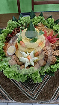 The beutiful of Tumpeng form java fo ritual ceremony photo