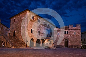 Bevagna, Perugia, Umbria, Italy: night view of the ancient main square with the medieval church and the Palazzo dei Consoli
