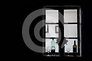 Bevanda or spritzer ingredients such as white wine and sparkling soda water on a window pane ready to be served photo