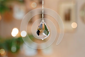 Bevelled Glass Crystal in front of Christmassy Bokeh Background