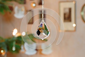 Bevelled Glass Crystal in front of Illuminated Christmas Tree Setting