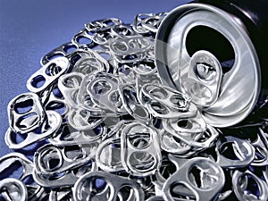 Beverage Can with Pile of Tabs for Recycling
