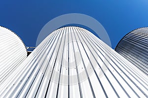 Beverage factory cylinders. With blue sky. photo