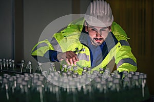 Beverage factory production line engineer checking production line