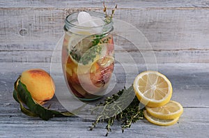 Beverage with peach and lemon and thyme.