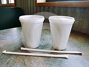 Beverage soft drink and drinking straw styrofoam plastic cup at a restaurant diner bar