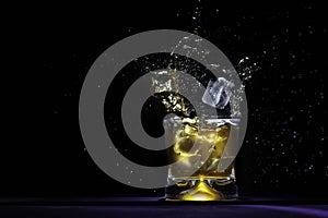 Beverage splash with spills out of glass