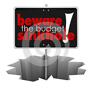 Beware the Budget Sinkhole Sign Hole Money Trouble Bankruptcy