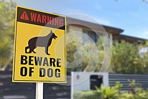 A Beware of Dog Sign in front of a gated home. Warning to visitors or burglars. Security and protection in a residential home