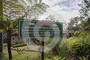 Beware of hippos and crocodiles sign warning for hotel guests