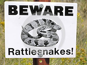 Beware of rattlesnakes signpost in the Badlands, South Dakota