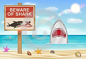 Beware of shark sign on sea sand beach