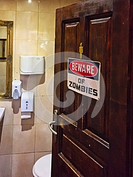 Beware of Zombies Sign on Male Public Toilet Door, Bulgaria