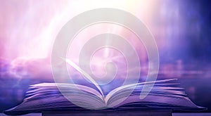Bewitched Book With Magic Glows In The Darkness  The blurred book that is bewitched with magic, the magic light in the dark, with