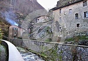 Beyond the stone walls covered with frost the stream and three houses and a fireplace that smokes in Fornovolasco.