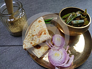 Bhindi Masala or stuffed Bhindi or okra, an Indian vegetable  on a plate with copy space