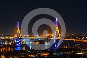 Bhumibol suspension bridge over Chao Phraya River at night in Bangkok city, Thailand