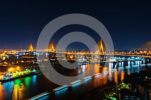 Bhumibol suspension bridge over Chao Phraya River at night in Bangkok city, Thailand
