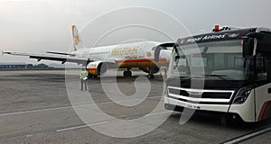 Bhutan Airlines airplane awaiting passengers at Kathmandu Airport, Nepal