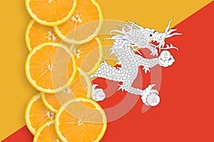 Bhutan flag and citrus fruit slices vertical row