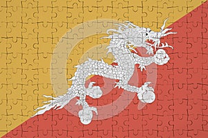 Bhutan flag is depicted on a folded puzzle