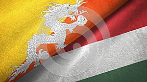 Bhutan and Hungary two flags textile cloth, fabric texture