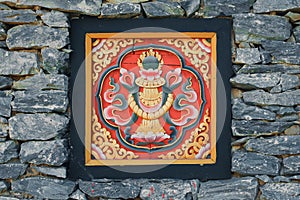 Bhutan style woodcraft on the rock wall