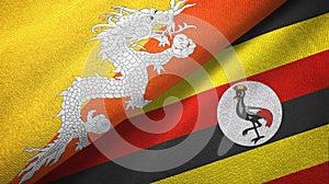 Bhutan and Uganda two flags textile cloth, fabric texture