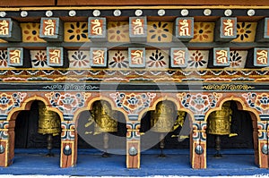 Bhutanese buddism praying wheels at Chimi Lhakang Monastery, Punakha, Bhutan