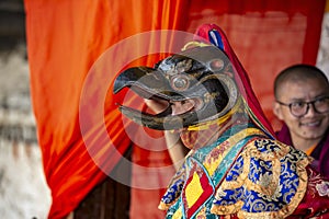 Bhutanese Cham masked dance, Buddhist lama dance, dancers behind the curtain and waiting for the play , Bumthang, central Bhutan.