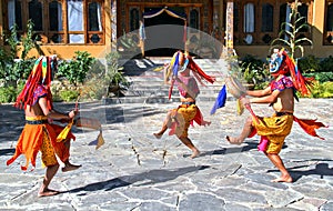 Bhutanese dancers with colorful mask performs traditional dance at hotel in Paro, Bhutan