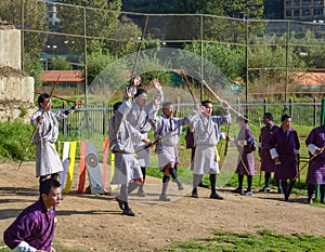Bhutanese men competes in a game of archery - Timphu, Bhutan.