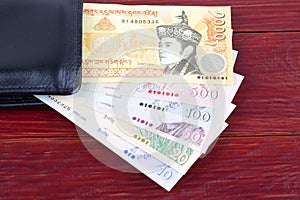 Bhutanese money in the black wallet