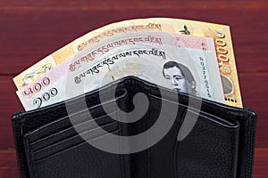 Bhutanese money in the black wallet