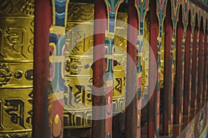 Bhutanese prayer wheels or Mani wheels, made of copper with the holy mantra embedded on the wheels, the symbol of Bhutanese