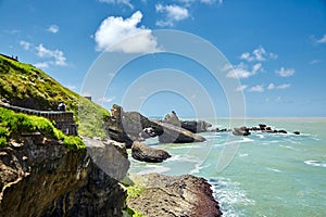 Biarritz city and view of its the famous landmark Rocher de la Vierge, a statue of Virgin Mary on the rock. France