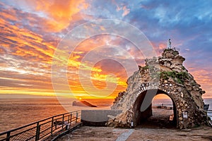 Biarritz, France, Rock of the Virgin on dramatical sunset photo