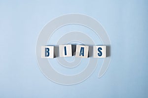 Bias - word from wooden blocks with letters, personal opinions prejudice bias concept