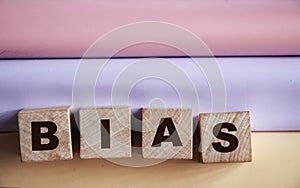 Bias word from wooden blocks, personal opinions prejudice bias concept