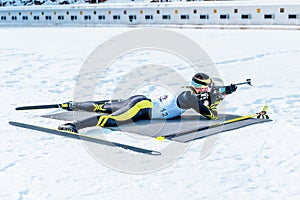 Biathlon lies and shooting  target with rifle photo