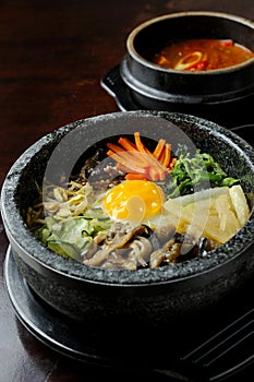Bibimbap in a heated stone bowl