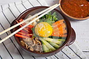 bibimbap in a heated stone bowl, korean dish