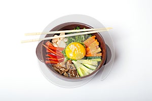 bibimbap in a heated stone bowl, korean dish