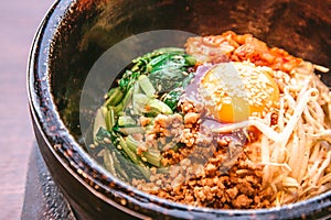 Bibimbap in a heated stone bowl, Korean food
