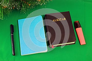 Bible Alkitab Blue Notebook Stationery on green background
