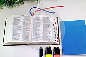 Bible Alkitab Open Blue Notebook and Stationery on White Background