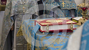 Bible in altar and priests