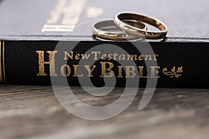 the bible is the base where upon two wedding rings rest