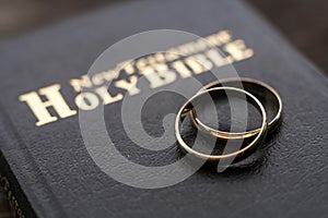 the bible is the base where upon two wedding rings rest