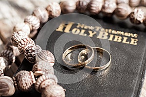 the bible is the base where upon two wedding rings rest